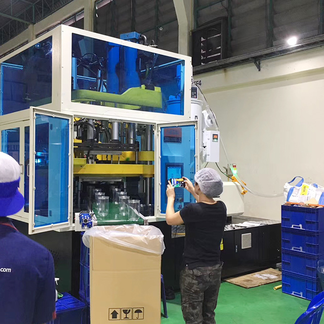 ISBM machine processing wide-mouth containers